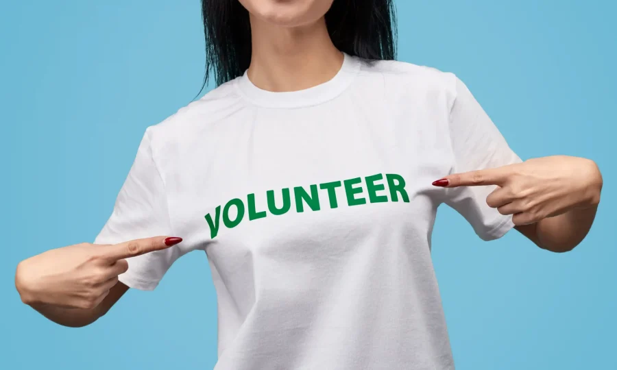 crop-volunteer-pointing-at-t-shirt-2023-11-27-04-57-58-utc